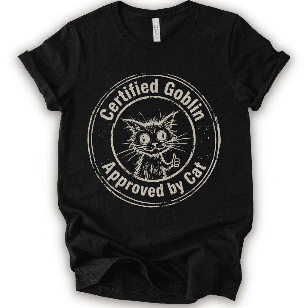 A black crewneck t-shirt with a distressed beige circular graphic that reads 'Certified Goblin Approved by Cat' around an illustration of a cat giving a thumbs-up.