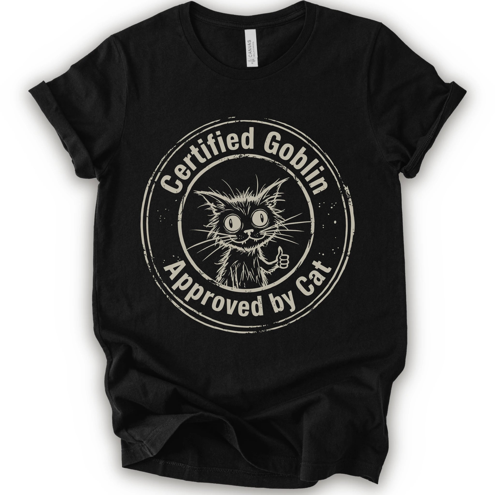 A black crewneck t-shirt with a distressed beige circular graphic that reads 'Certified Goblin Approved by Cat' around an illustration of a cat giving a thumbs-up.