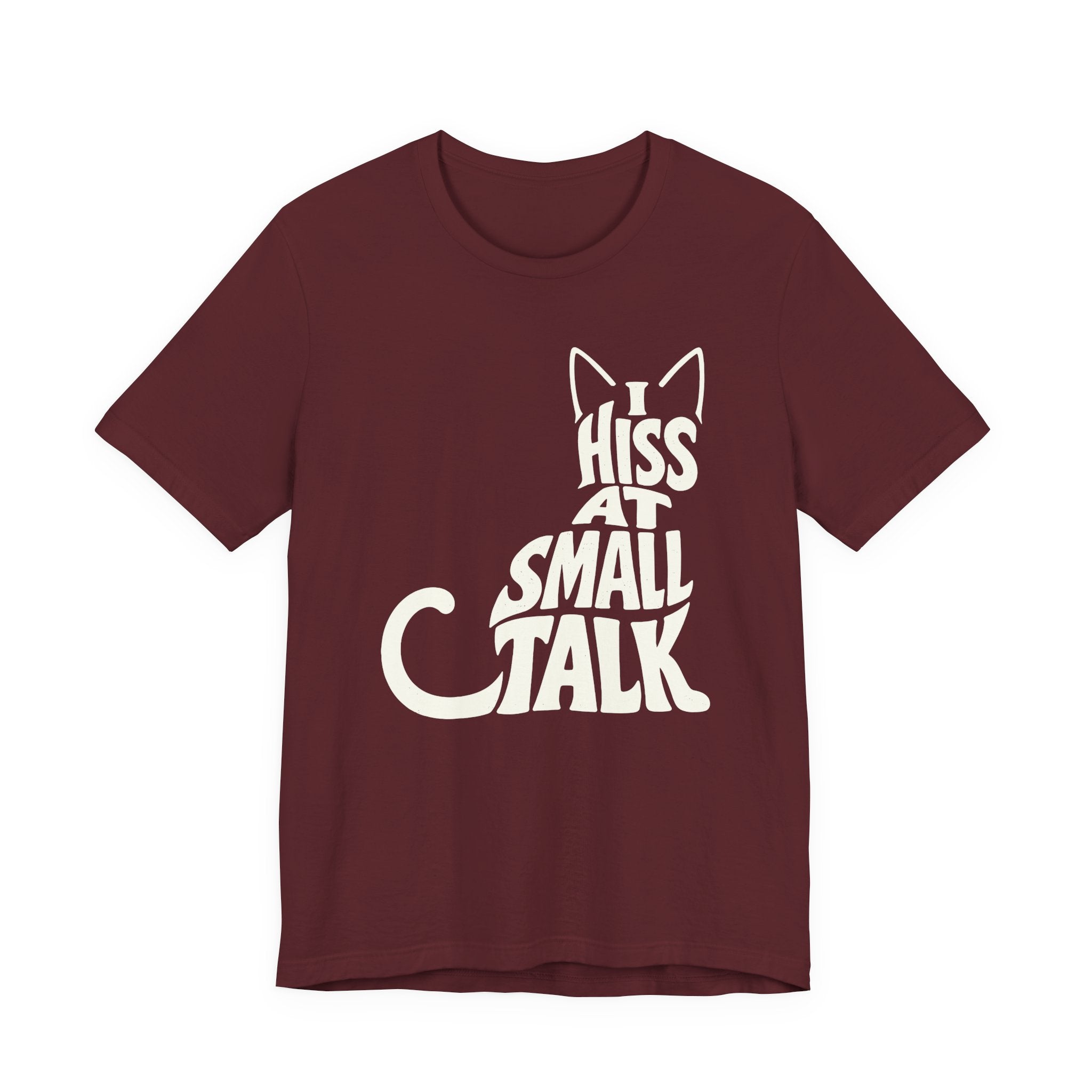 A maroon short-sleeve crewneck t-shirt featuring a graphic with Off-white “I Hiss at Small Talk” typography with pointed cat ears and a large curved tail