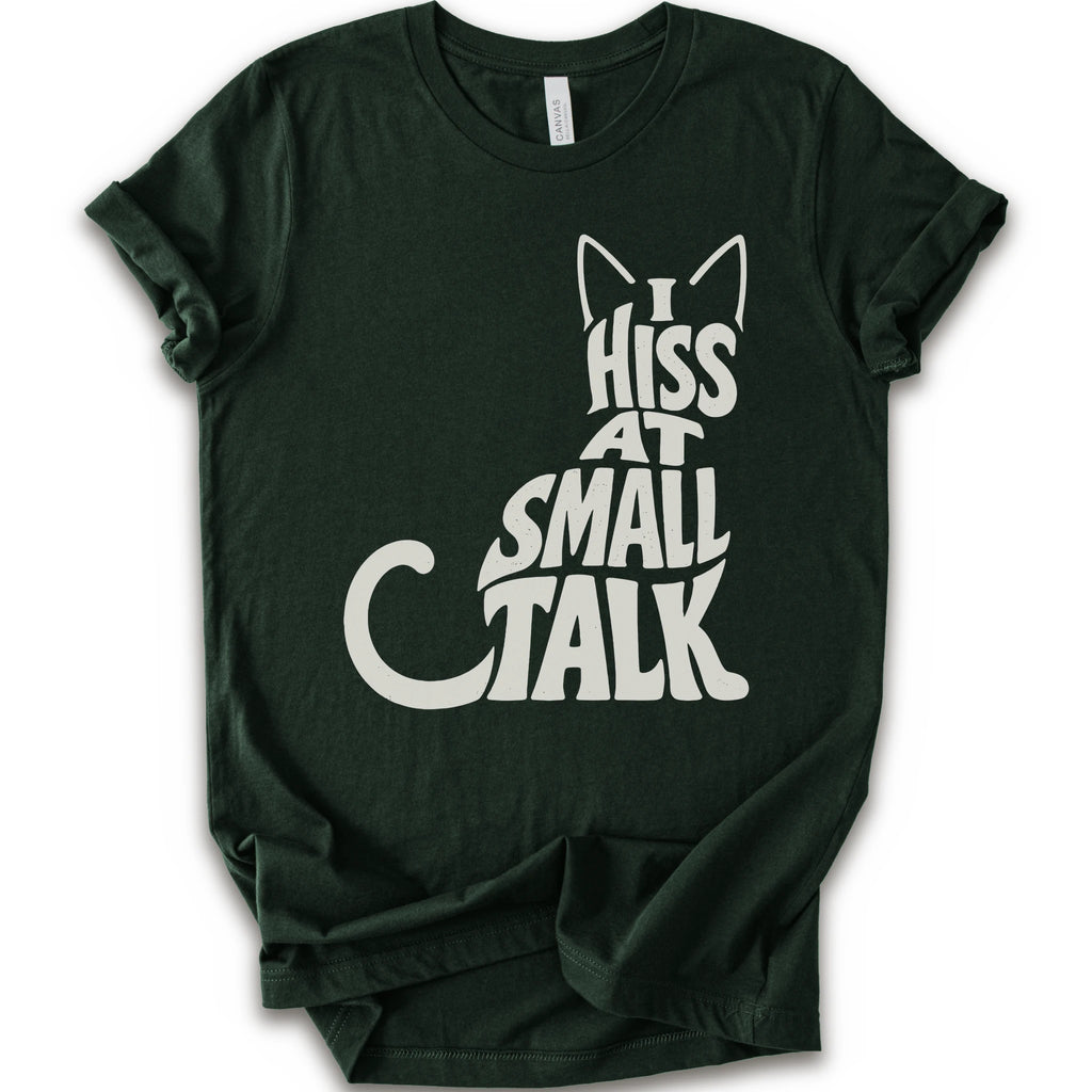 Forest graphic t-shirt with off-white “I Hiss at Small Talk” typography with pointed cat ears and a large curved tail