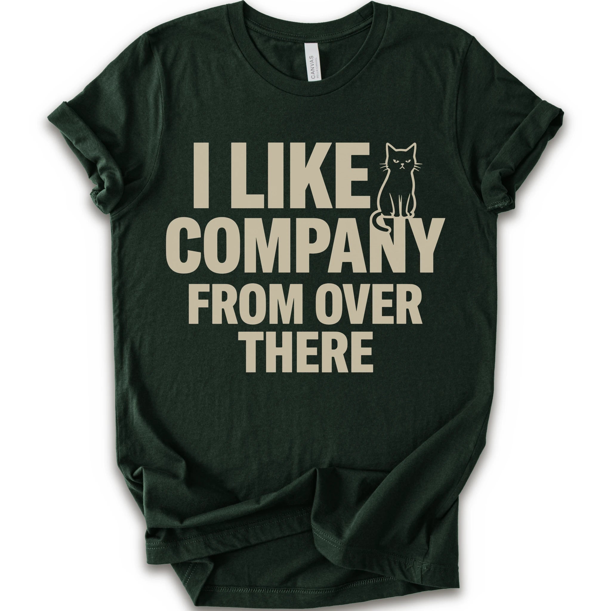 Forest graphic t-shirt with "I Like Company From Over There" text with an unimpressed sitting cat in a bold stacked T-shirt design