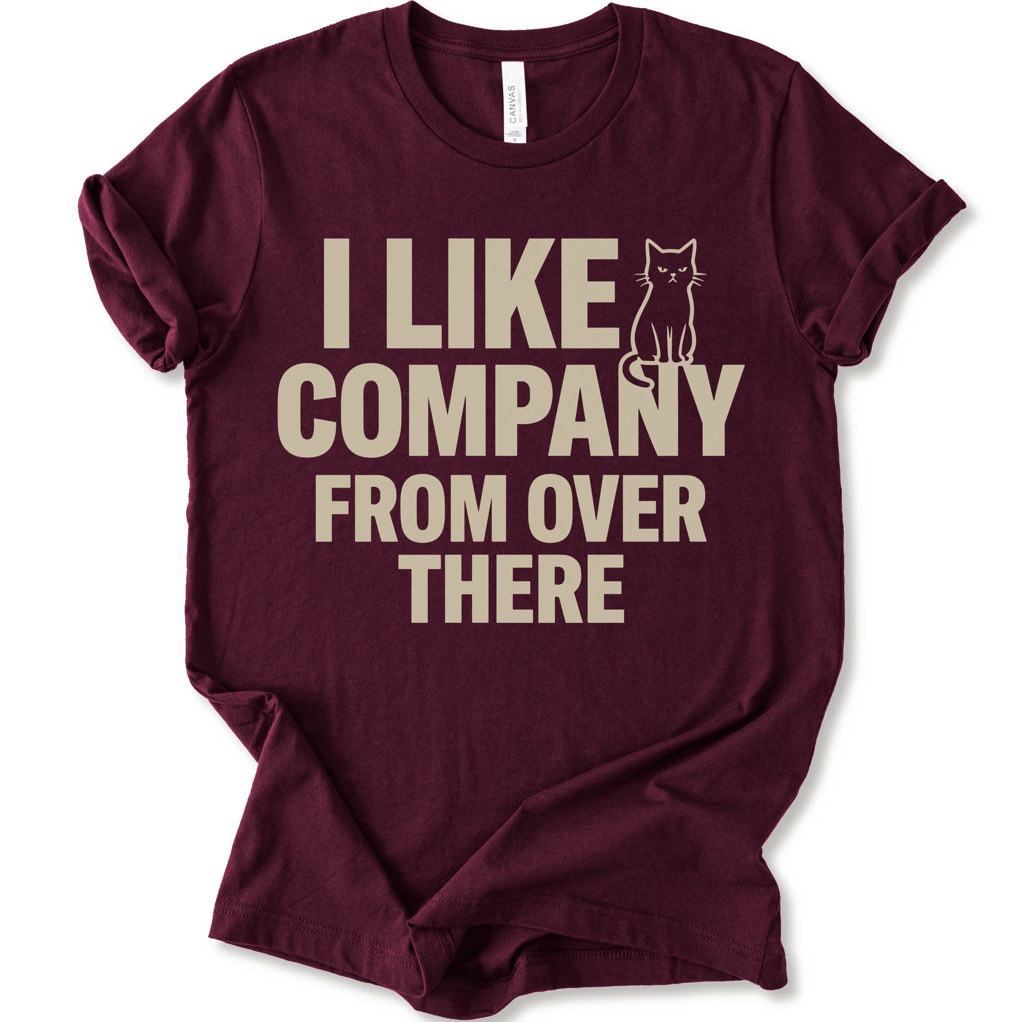 Maroon graphic t-shirt with "I Like Company From Over There" text with an unimpressed sitting cat in a bold stacked T-shirt design