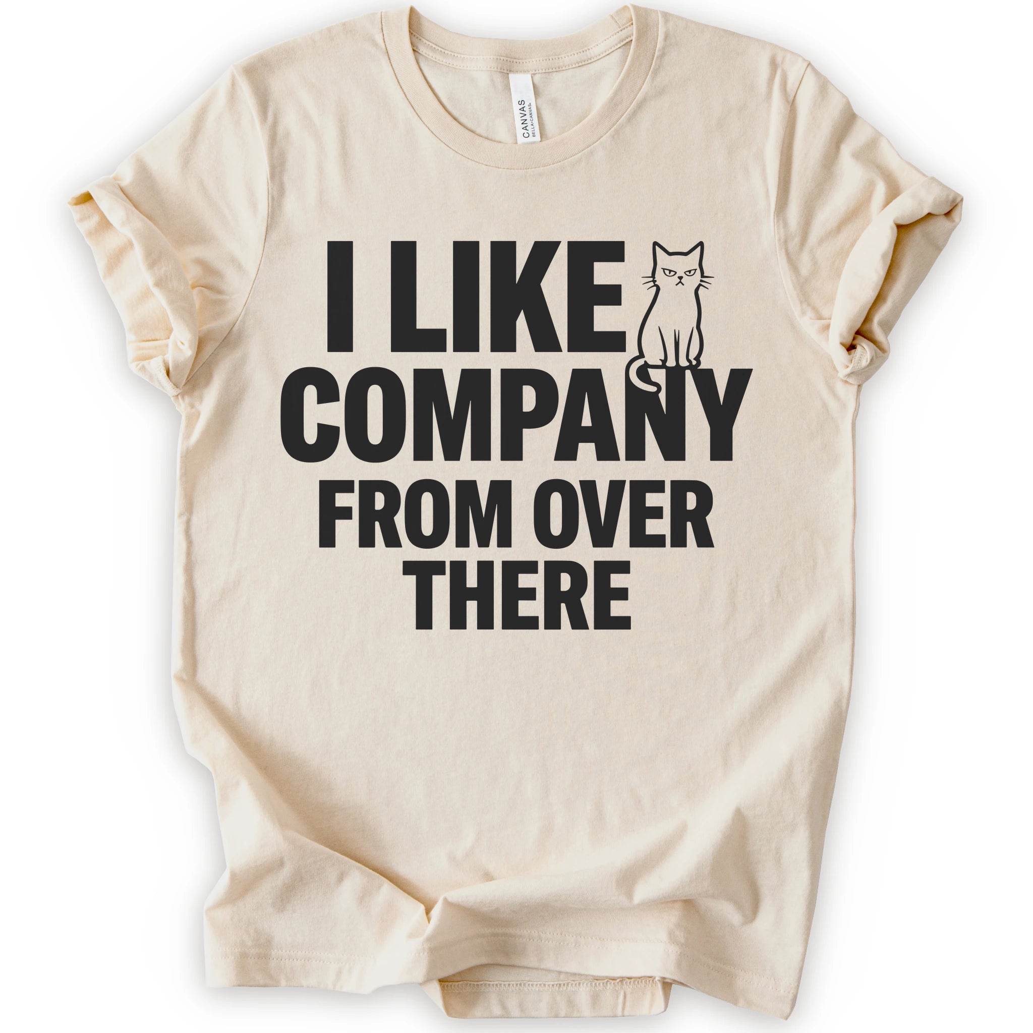 Natural graphic t-shirt with "I Like Company From Over There" text with an unimpressed sitting cat in a bold stacked T-shirt design