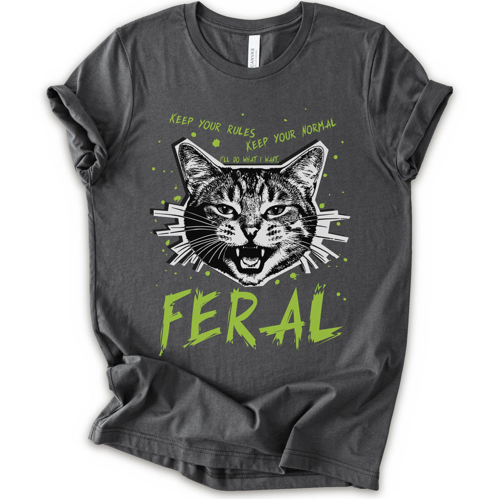 A asphalt short-sleeve graphic t-shirt featuring a stylized illustration of a cat's face with the text 'KEEP YOUR RULES KEEP YOUR NORMAL' above and 'FERAL' in distressed lime green below.