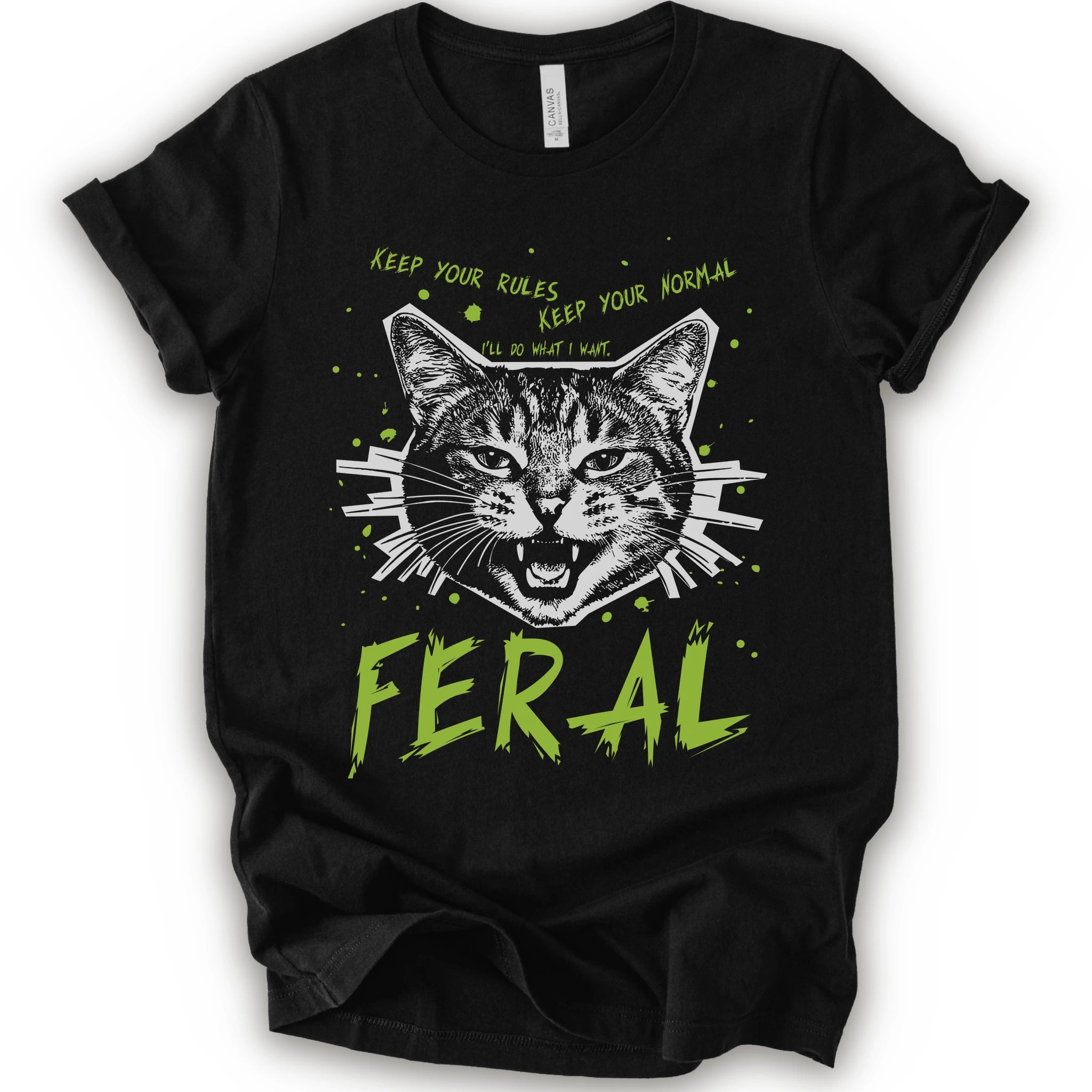 A black short-sleeve graphic t-shirt featuring a stylized illustration of a cat's face with the text 'KEEP YOUR RULES KEEP YOUR NORMAL' above and 'FERAL' in distressed lime green below.