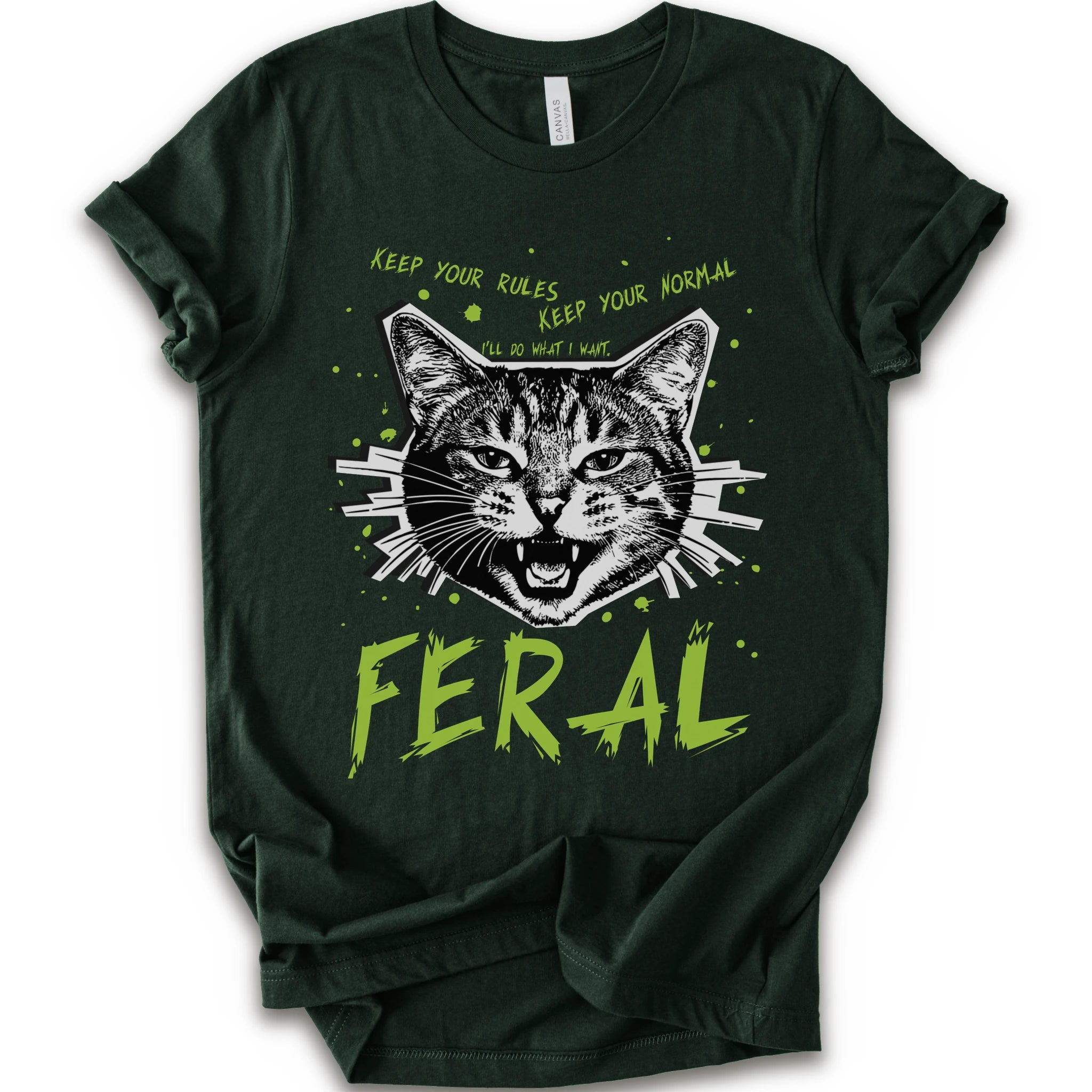 A forest short-sleeve graphic t-shirt featuring a stylized illustration of a cat's face with the text 'KEEP YOUR RULES KEEP YOUR NORMAL' above and 'FERAL' in distressed lime green below.