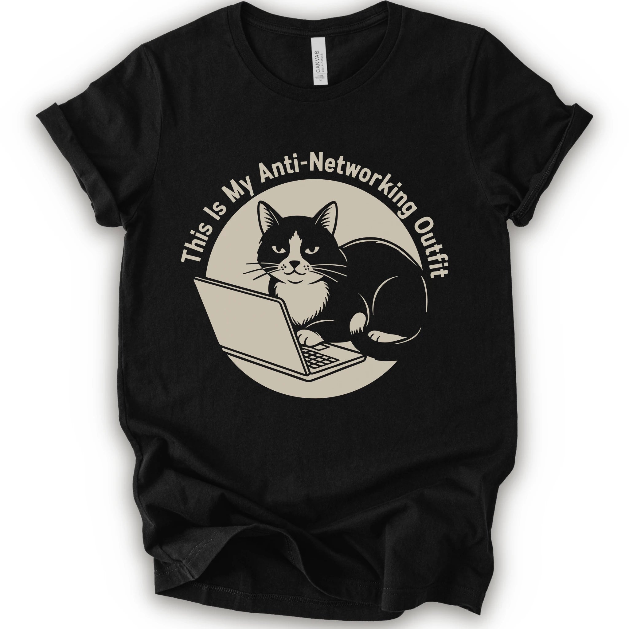 A black T-shirt with a “This Is My Anti-Networking Outfit” curves above a black-and-white cat sitting at an open laptop. The artwork uses a clean circular badge layout with a limited black-and-cream palette.