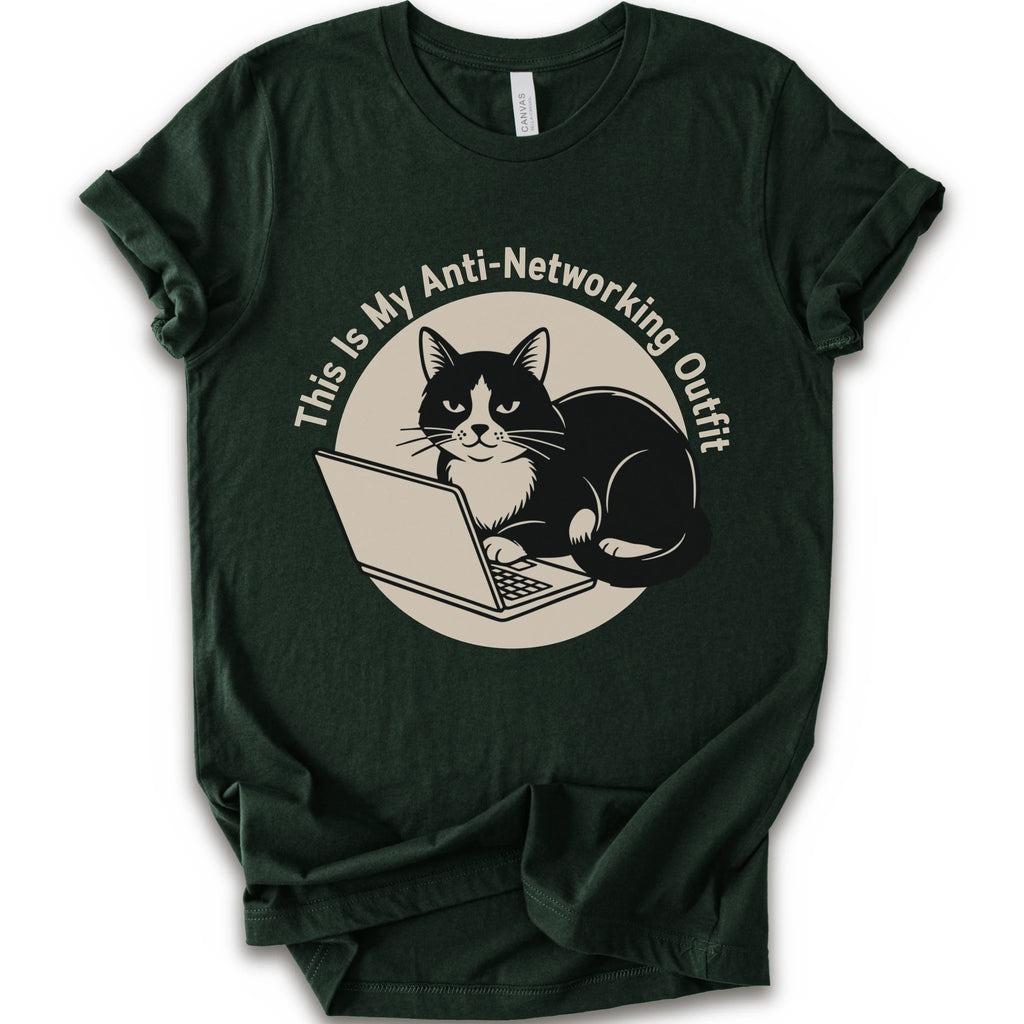 A forest T-shirt with a “This Is My Anti-Networking Outfit” curves above a black-and-white cat sitting at an open laptop. The artwork uses a clean circular badge layout with a limited black-and-cream palette.