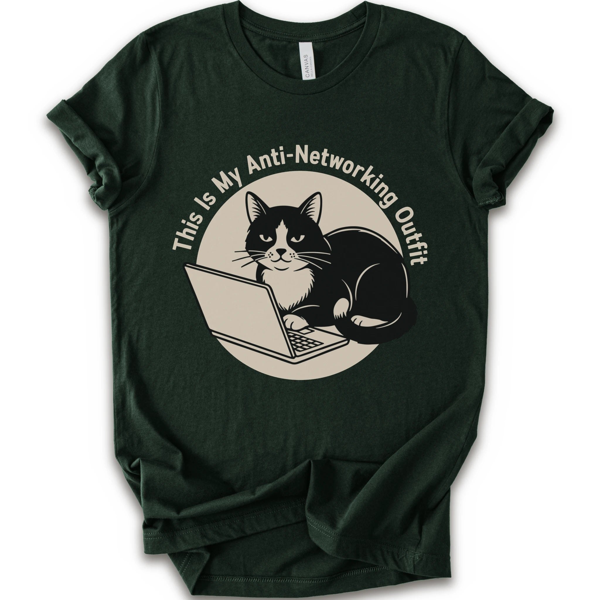 A forest T-shirt with a “This Is My Anti-Networking Outfit” curves above a black-and-white cat sitting at an open laptop. The artwork uses a clean circular badge layout with a limited black-and-cream palette.
