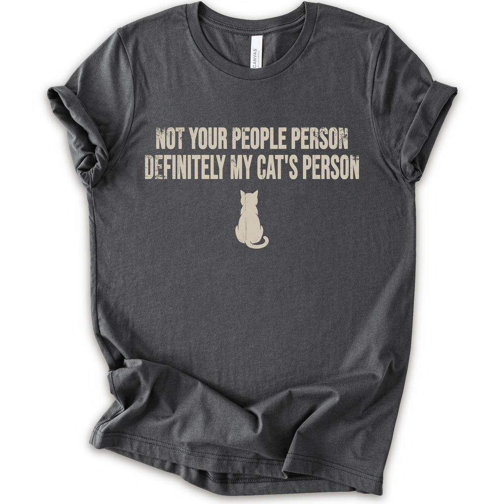 A asphalt short-sleeve crewneck t-shirt with a beige graphic print that reads 'NOT YOUR PEOPLE PERSON DEFINITELY MY CAT'S PERSON' above a small cat silhouette.