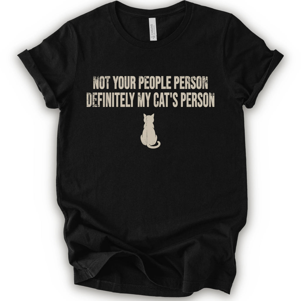 A black short-sleeve crewneck t-shirt with a beige graphic print that reads 'NOT YOUR PEOPLE PERSON DEFINITELY MY CAT'S PERSON' above a small cat silhouette.