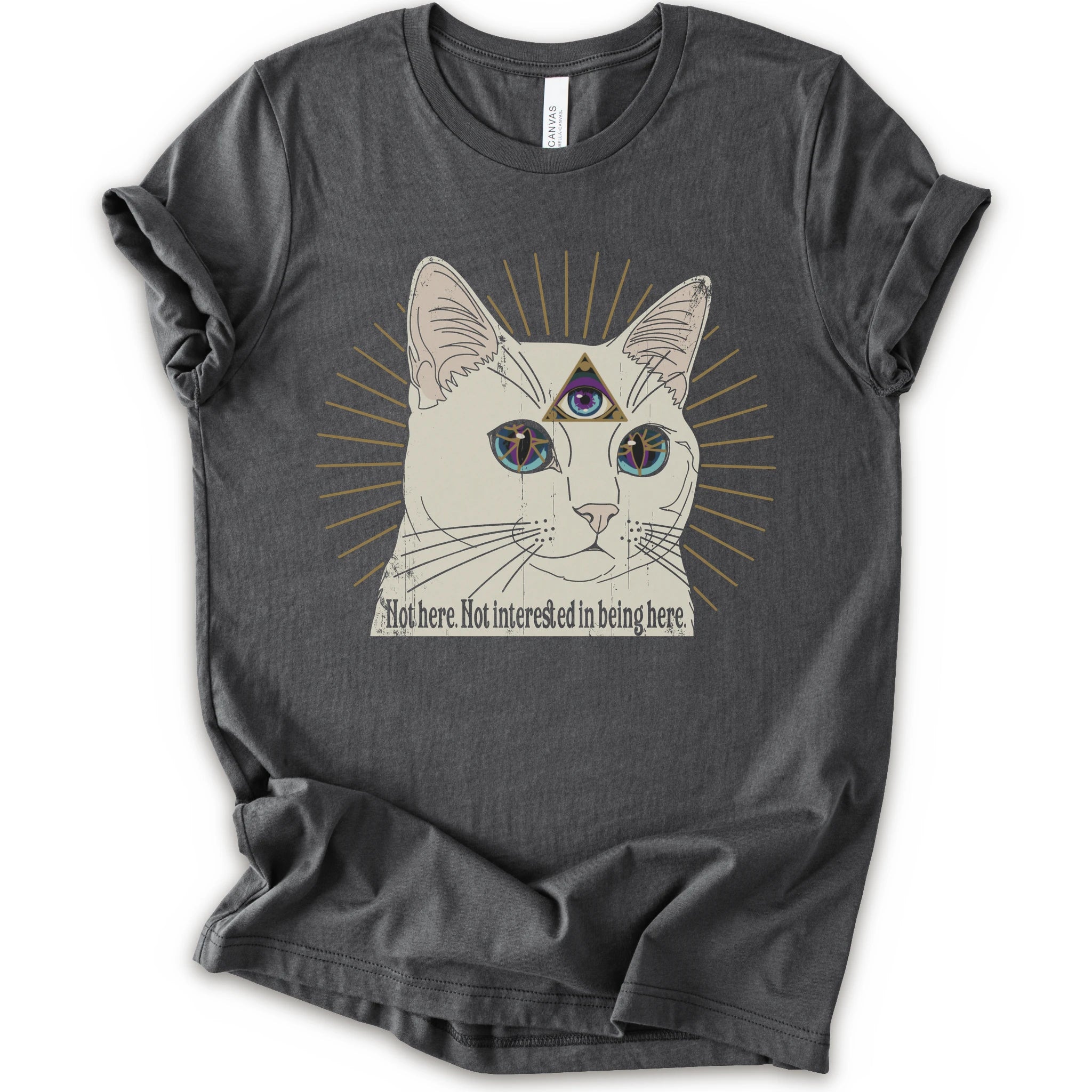 An asphalt short-sleeve crewneck t-shirt featuring a graphic of a white cat with a third eye and gold sunburst rays, with the text 'Not here. Not interested in being here.