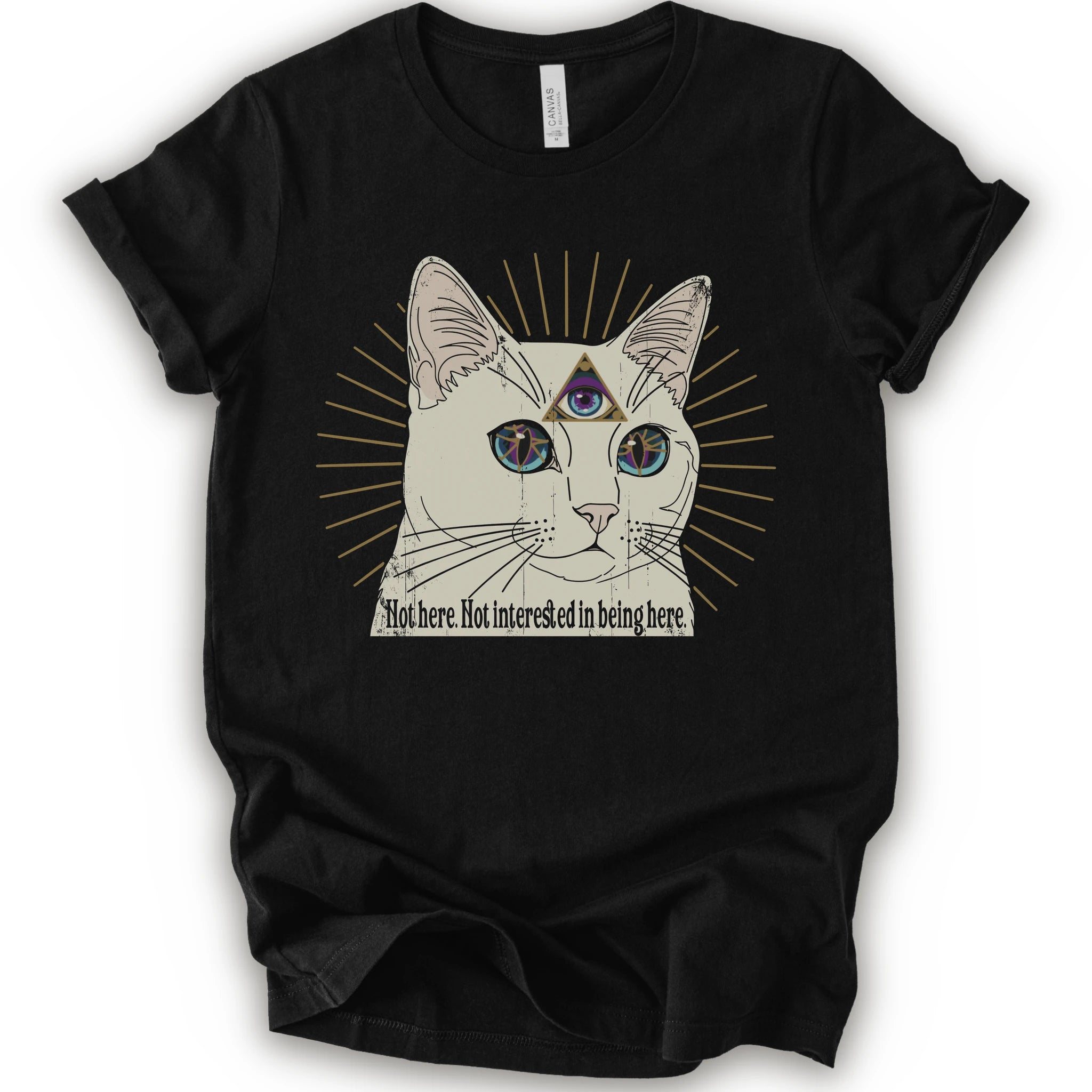 A black short-sleeve crewneck t-shirt featuring a graphic of a white cat with a third eye and gold sunburst rays, with the text 'Not here. Not interested in being here.