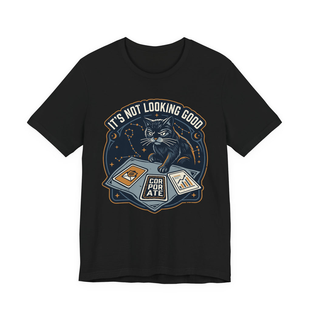 Black Tee with “It’s Not Looking Good” text above a cat reading tarot-style corporate cards with moons and stars