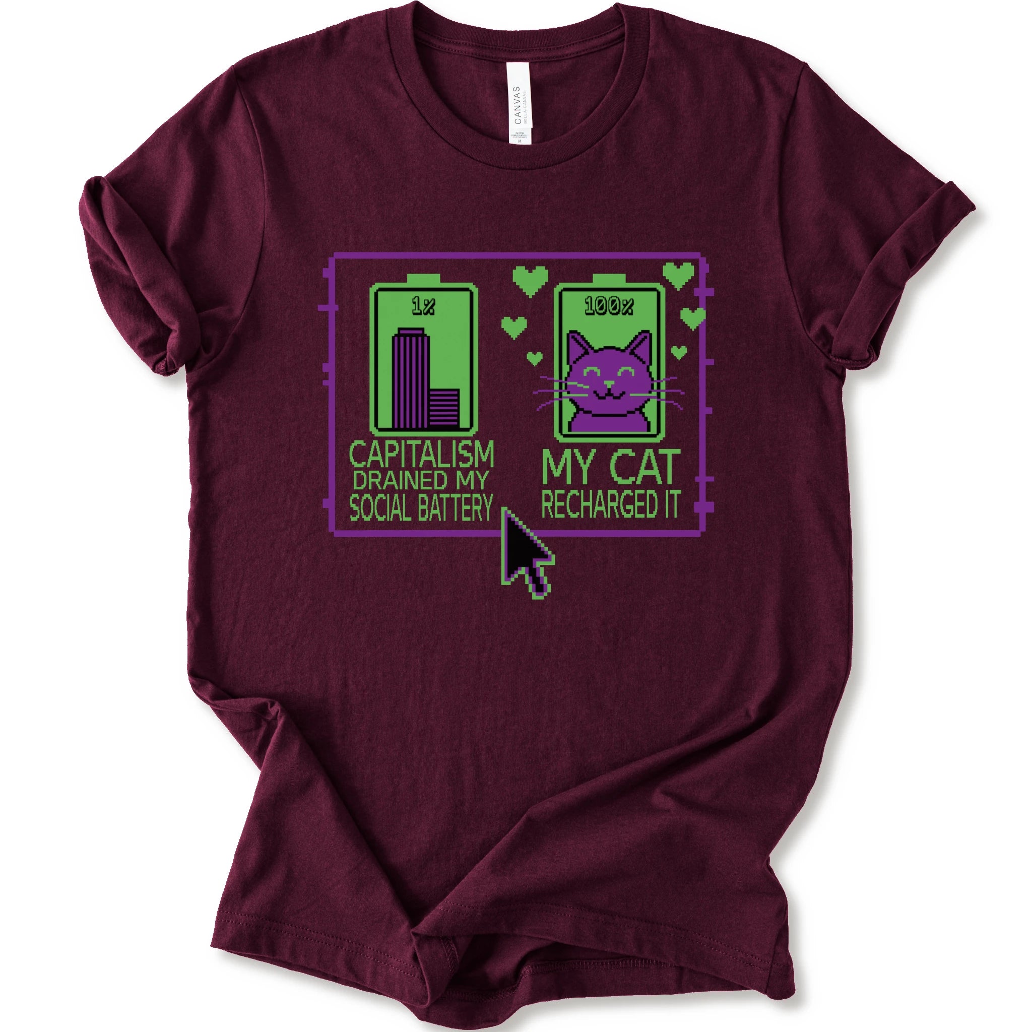 A maroon short-sleeve crewneck T-shirt with pixel batteries, cat graphic, and “Capitalism drained my social battery. My cat recharged it.”