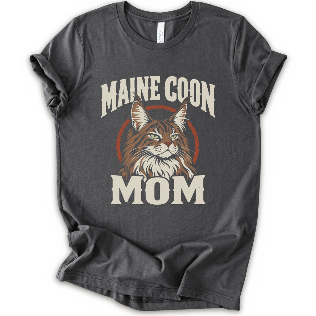 An asphalt short-sleeve crewneck t-shirt featuring a graphic print of a Maine Coon cat with the text 'MAINE COON MOM' in distressed cream lettering.