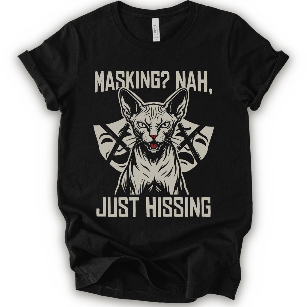 A black short-sleeve graphic t-shirt featuring a stylized illustration of a sphynx cat with crossed arrows behind it and the text 'MASKING? NAH, JUST HISSING' in a distressed off-white font.