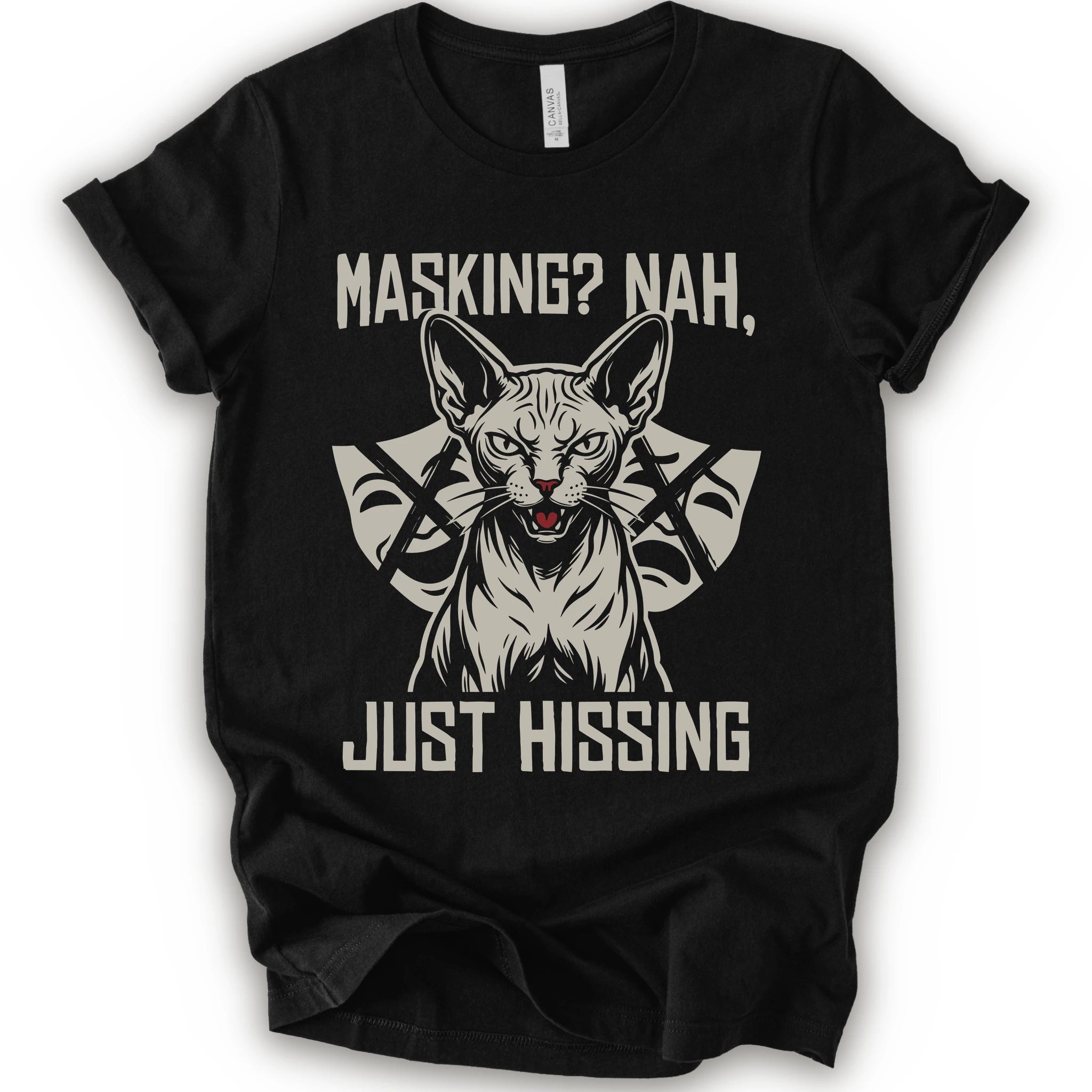 A black short-sleeve graphic t-shirt featuring a stylized illustration of a sphynx cat with crossed arrows behind it and the text 'MASKING? NAH, JUST HISSING' in a distressed off-white font.