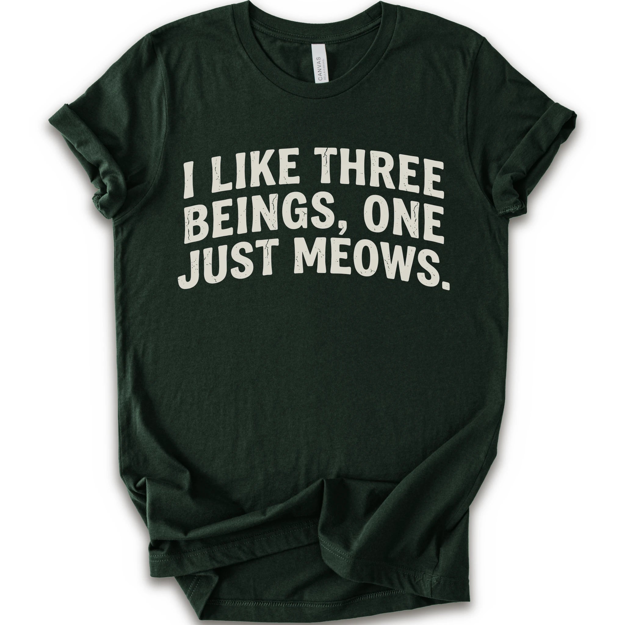 Forest graphic t-shirt with distressed cream text reading “I LIKE THREE BEINGS, ONE JUST MEOWS.” for an introvert cat T-shirt