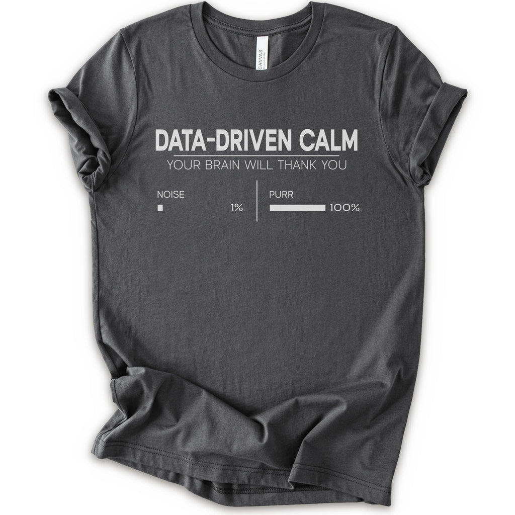 A asphalt short-sleeve crewneck t-shirt with a white graphic print that reads 'DATA-DRIVEN CALM YOUR BRAIN WILL THANK YOU' above a progress bar labeled 'NOISE 1% | PURR 100%'.