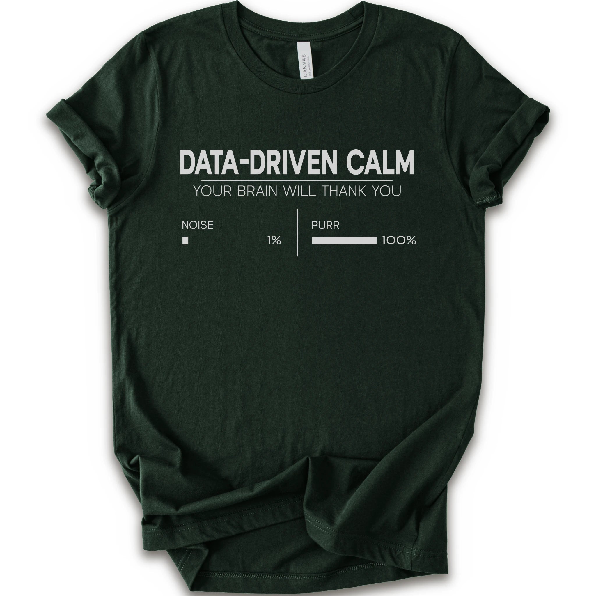 A forest short-sleeve crewneck t-shirt with a white graphic print that reads 'DATA-DRIVEN CALM YOUR BRAIN WILL THANK YOU' above a progress bar labeled 'NOISE 1% | PURR 100%'.