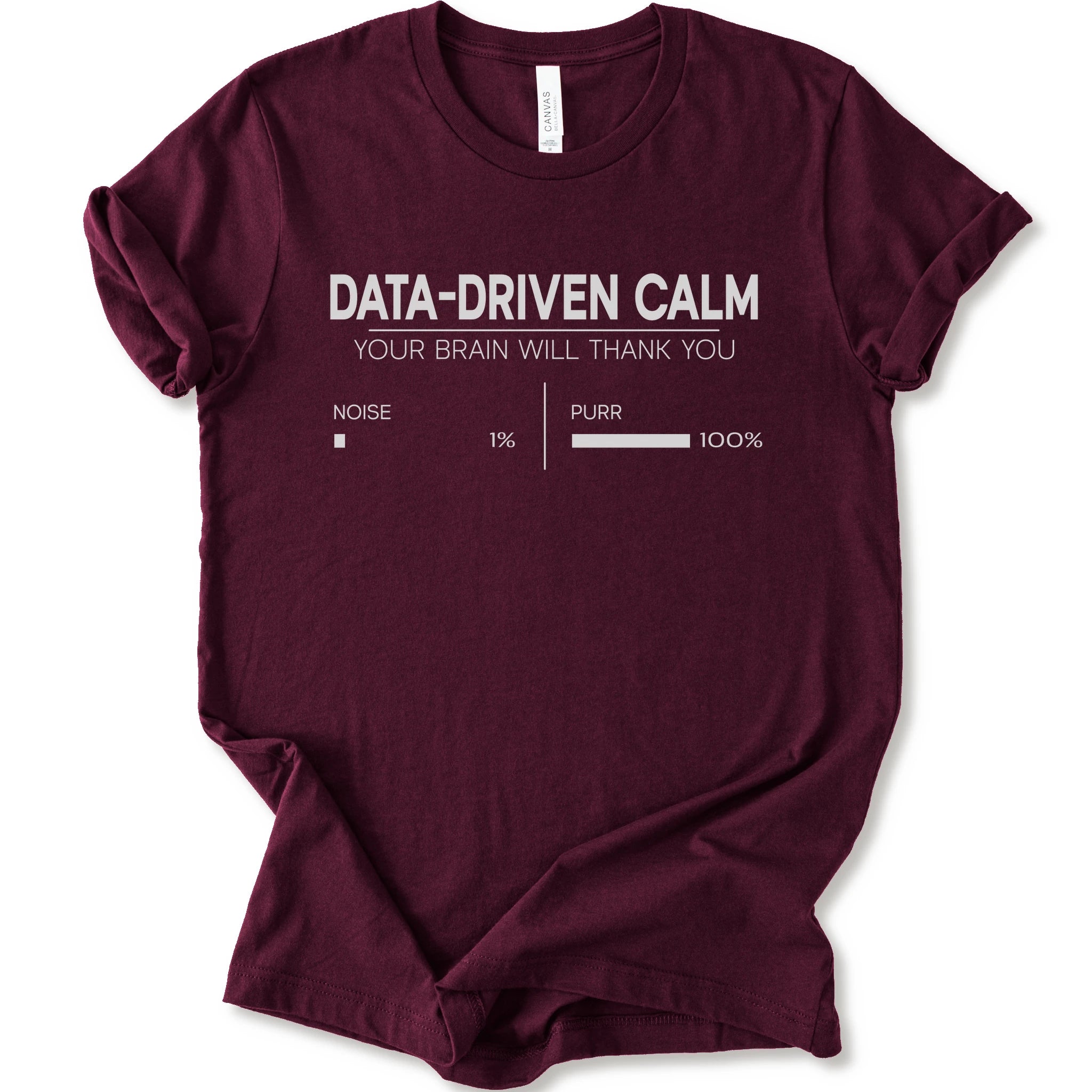 A maroon short-sleeve crewneck t-shirt with a white graphic print that reads 'DATA-DRIVEN CALM YOUR BRAIN WILL THANK YOU' above a progress bar labeled 'NOISE 1% | PURR 100%'.