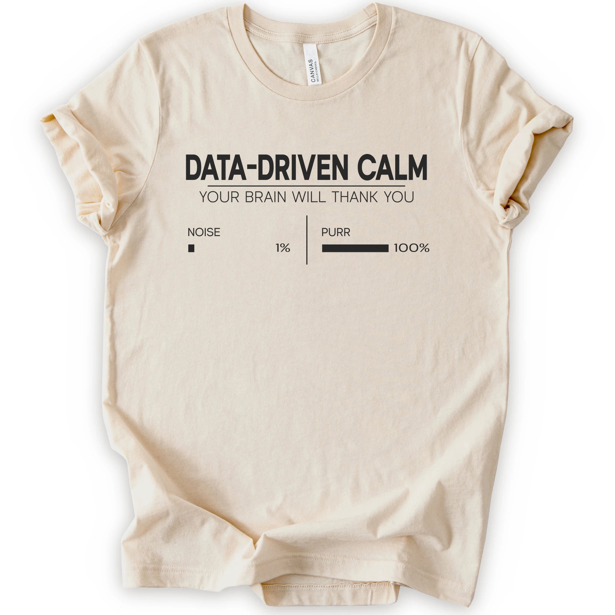 A natural short-sleeve crewneck t-shirt with a black graphic print that reads 'DATA-DRIVEN CALM YOUR BRAIN WILL THANK YOU' above a progress bar labeled 'NOISE 1% | PURR 100%'.