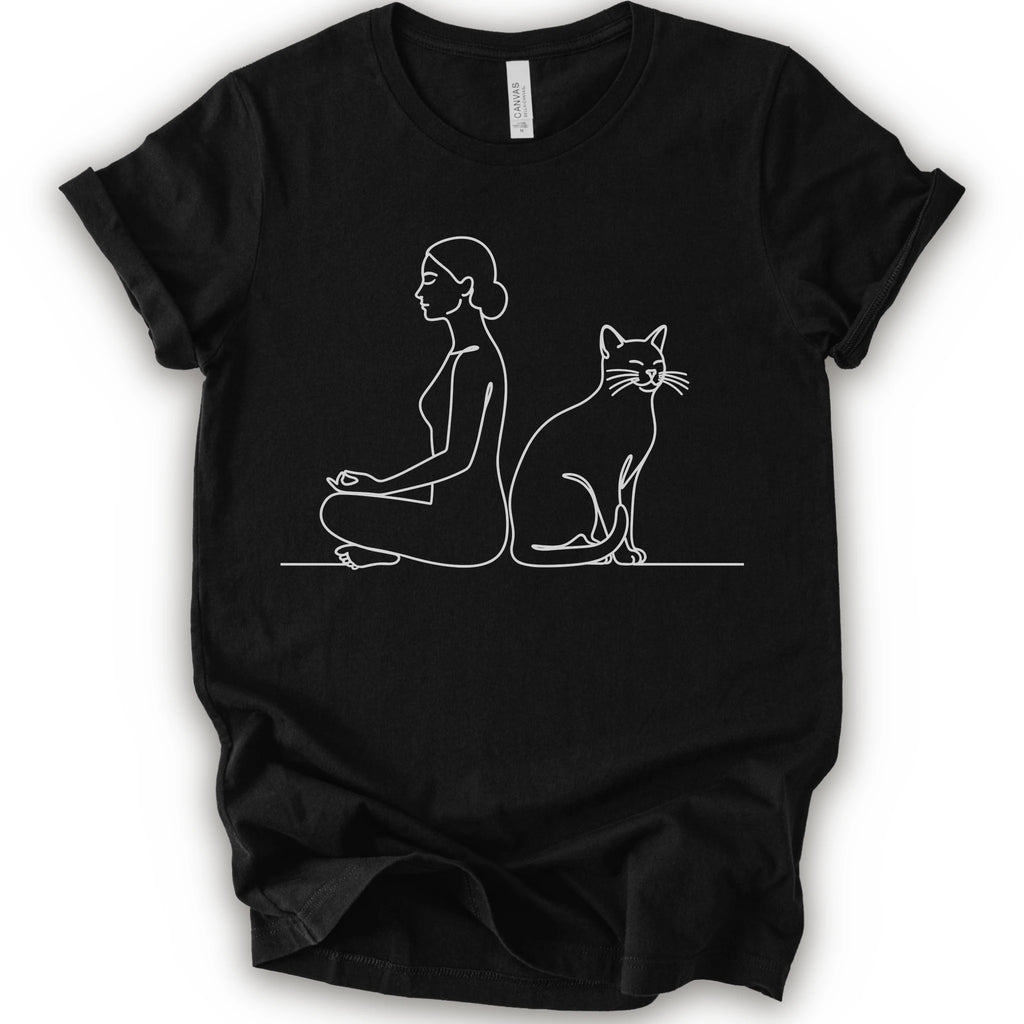 A black short-sleeve crewneck t-shirt with a minimalist white line art graphic of a woman in a meditation pose next to a cat.