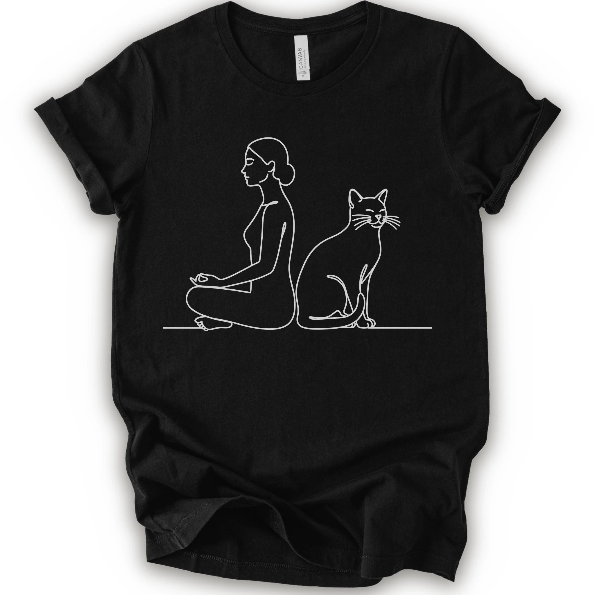 A black short-sleeve crewneck t-shirt with a minimalist white line art graphic of a woman in a meditation pose next to a cat.
