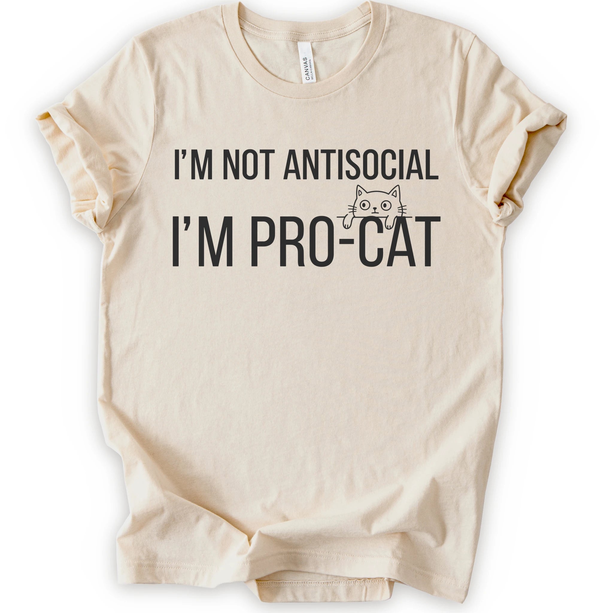 A natural short-sleeve crewneck t-shirt with a black graphic print that reads 'I'M NOT ANTISOCIAL I'M PRO-CAT' alongside a small cartoon cat face.