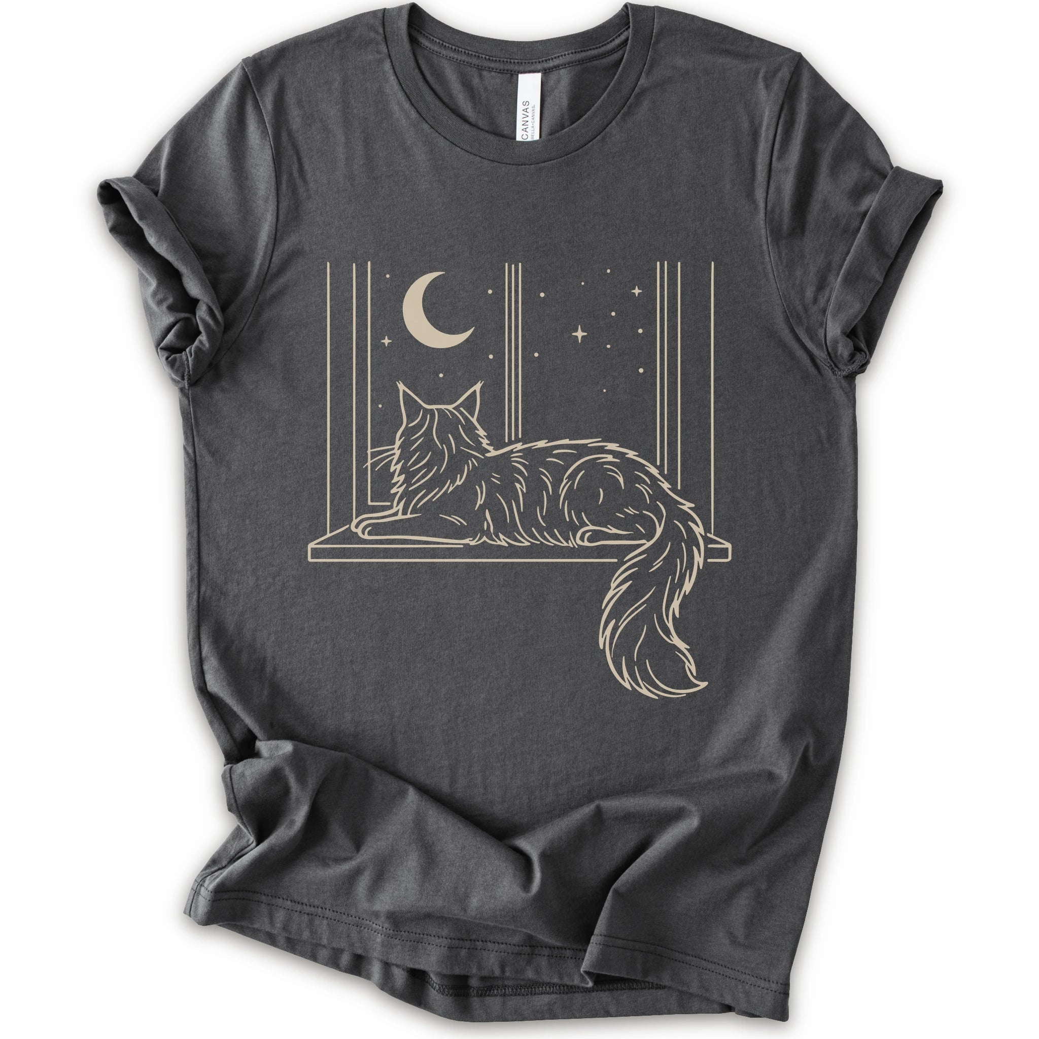 A asphalt short-sleeve crewneck t-shirt with a graphic print of a long-haired maine coon resting on a windowsill under a crescent moon and stars.