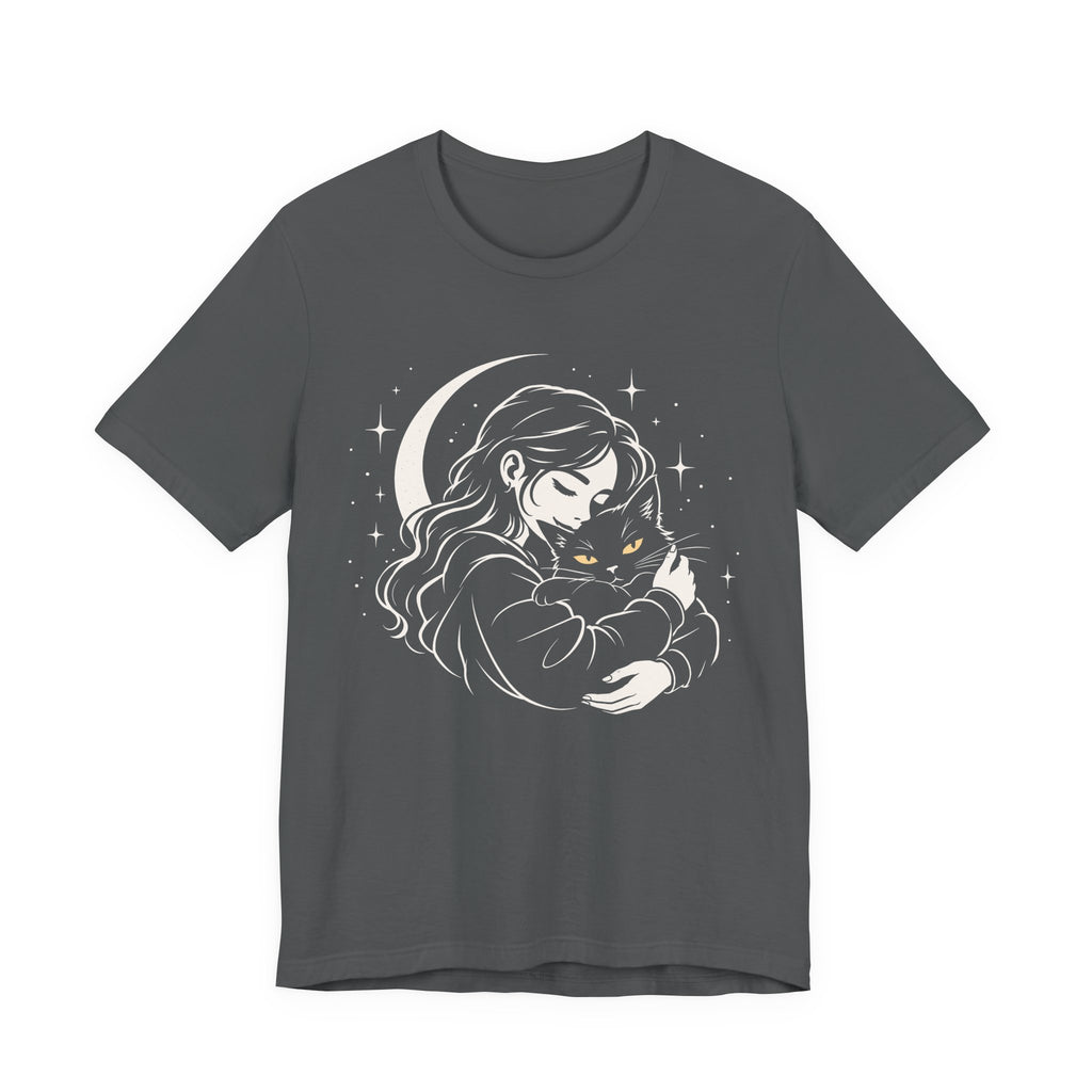 Grey tee with Woman embracing a fluffy cat beneath a crescent moon and stars, drawn in cream lines with golden cat eyes