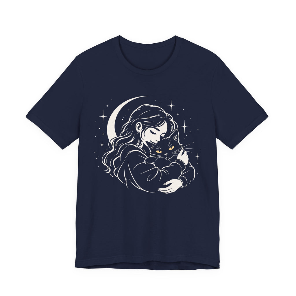 Navy tee with Woman embracing a fluffy cat beneath a crescent moon and stars, drawn in cream lines with golden cat eyes