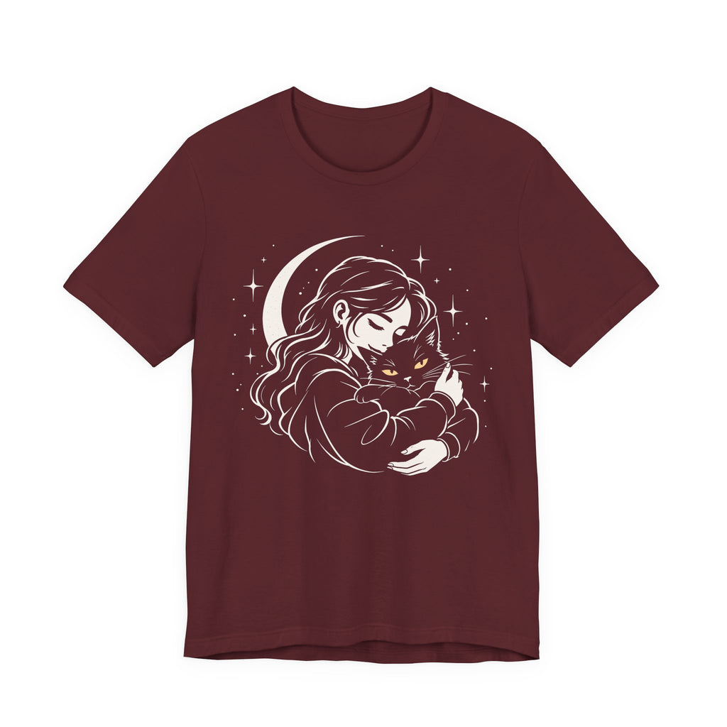 Red t-shirt with Woman embracing a fluffy cat beneath a crescent moon and stars, drawn in cream lines with golden cat eyes