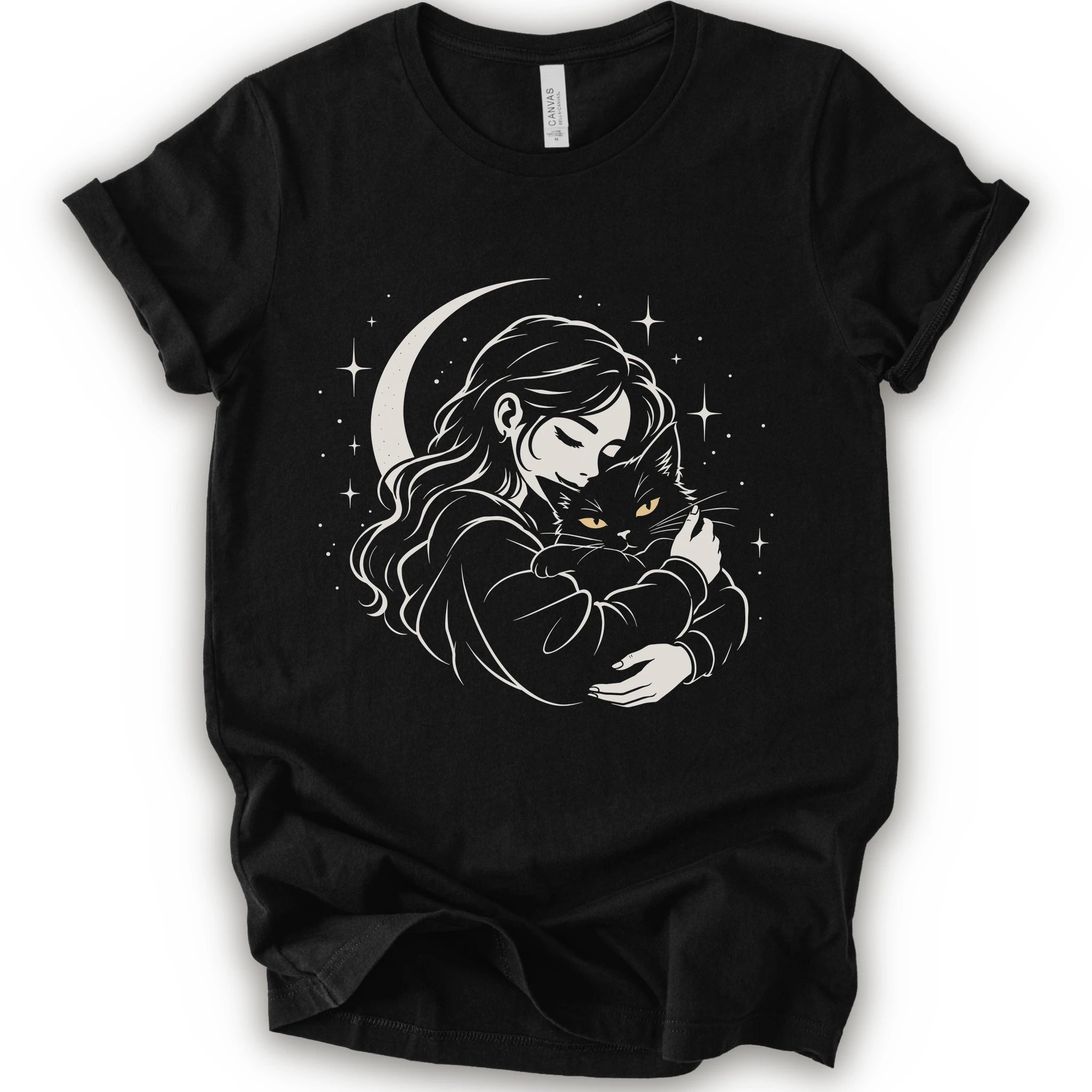 Black graphic t-shirt with a woman hugging a fluffy cat beneath a crescent moon and stars, drawn in cream lines with golden cat eyes