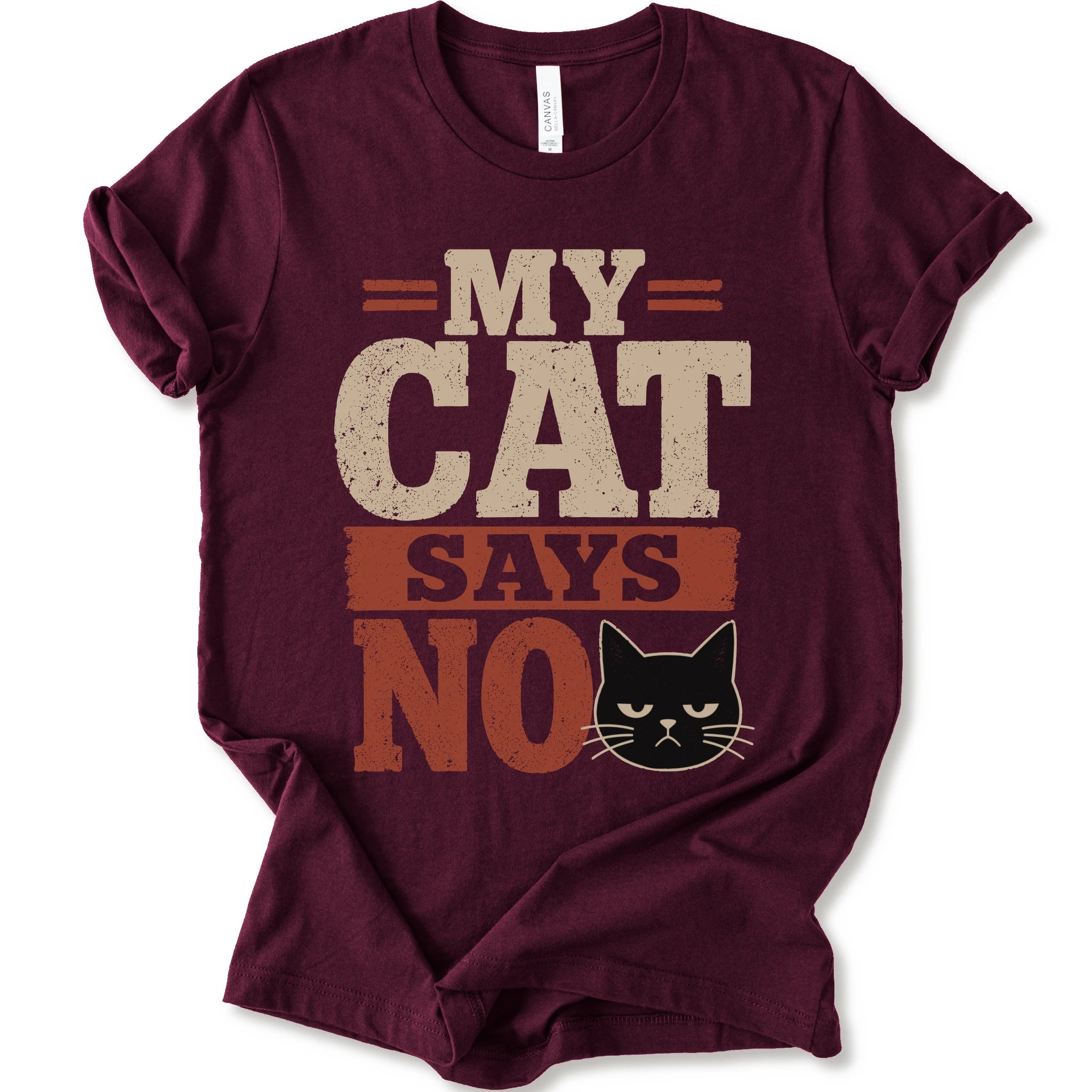 A maroon short-sleeve t-shirt with a graphic print that reads 'MY CAT SAYS NO' in distressed beige and rust orange lettering, accompanied by a black cat illustration