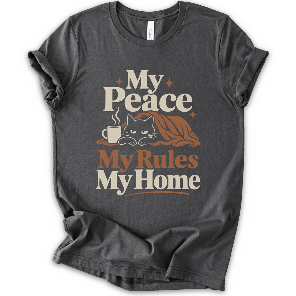 A asphalt short-sleeve crewneck t-shirt with a retro-style graphic print that reads 'My Peace My Rules My Home' in cream and brown text, featuring an illustration of a black cat under a brown blanket next to a small mug.