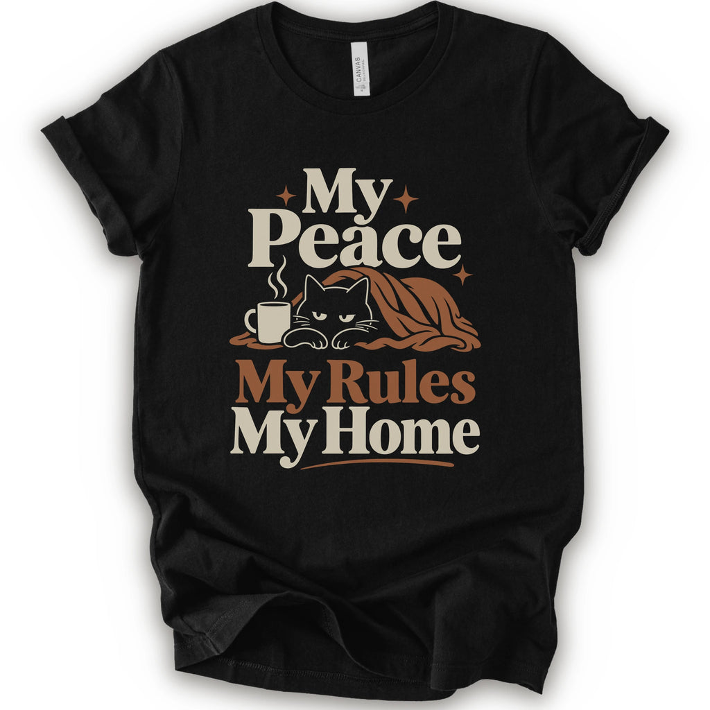 A black short-sleeve crewneck t-shirt with a retro-style graphic print that reads 'My Peace My Rules My Home' in cream and brown text, featuring an illustration of a black cat under a brown blanket next to a small mug.