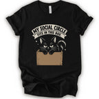 A black short-sleeve crewneck t-shirt with a graphic print of a black cat in a cardboard box and the text 'MY SOCIAL CIRCLE FITS IN THIS BOX."