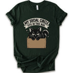 A forest short-sleeve crewneck t-shirt with a graphic print of a black cat in a cardboard box and the text 'MY SOCIAL CIRCLE FITS IN THIS BOX."