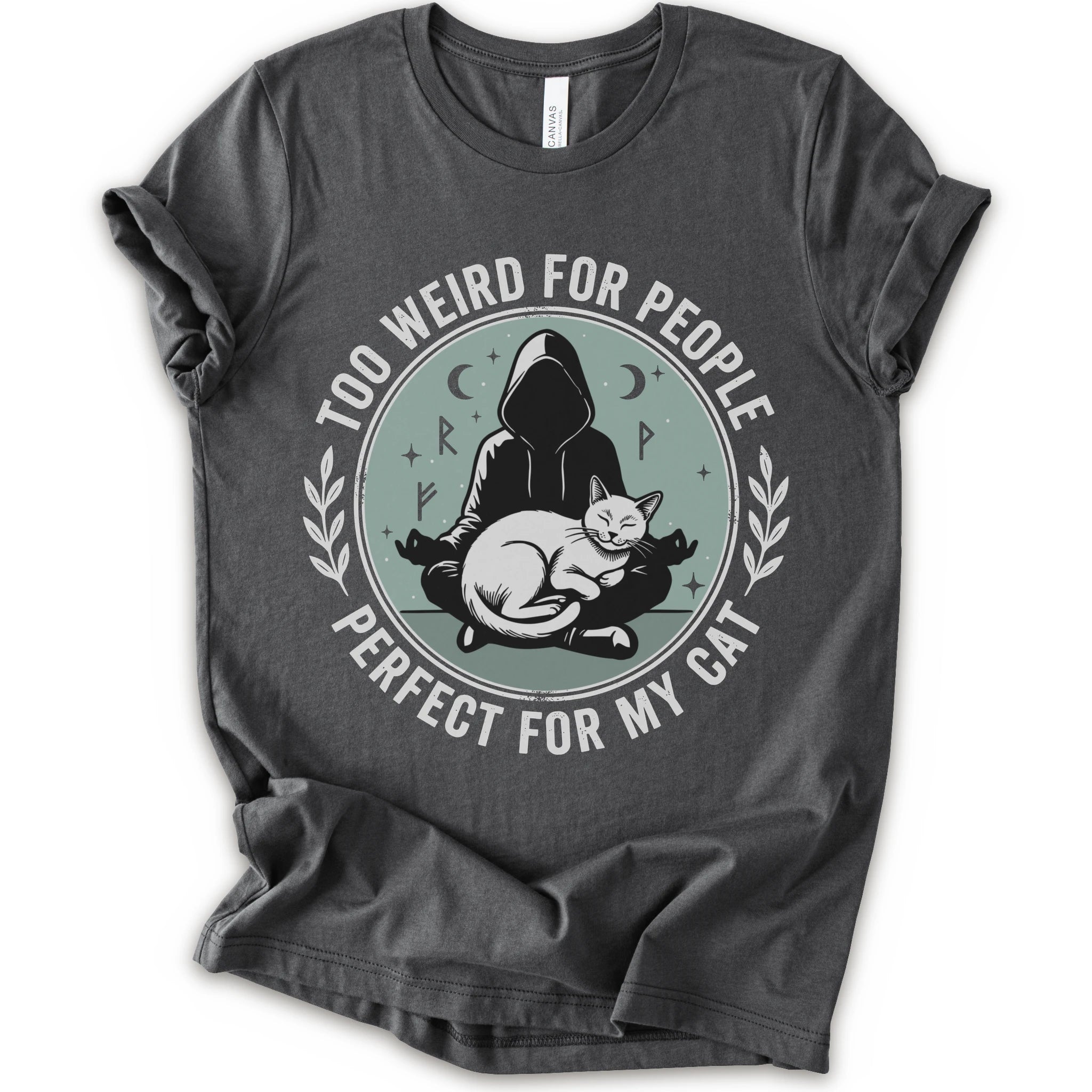 A asphalt short-sleeve crewneck t-shirt with a circular graphic on the front. The graphic features a dark silhouette of a person in a hood sitting cross-legged next to a white cat, surrounded by the text 'TOO WEIRD FOR PEOPLE' on top and 'PERFECT FOR MY CAT' on the bottom, with small moon and star details.