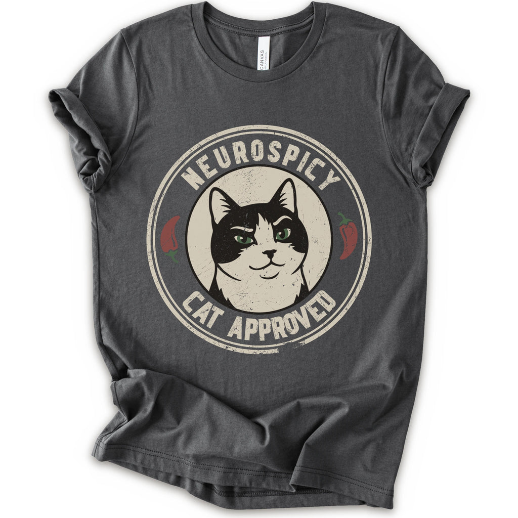 A asphalt short-sleeve crewneck t-shirt with a distressed circular graphic on the chest featuring a black and white cat with green eyes, red peppers, and the text 'NEUROSPICY, CAT APPROVED'.
