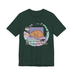 Green Tee with Sleeping orange tabby curled on a laptop with the text “None of Your Emails Are Finding Me Offline”