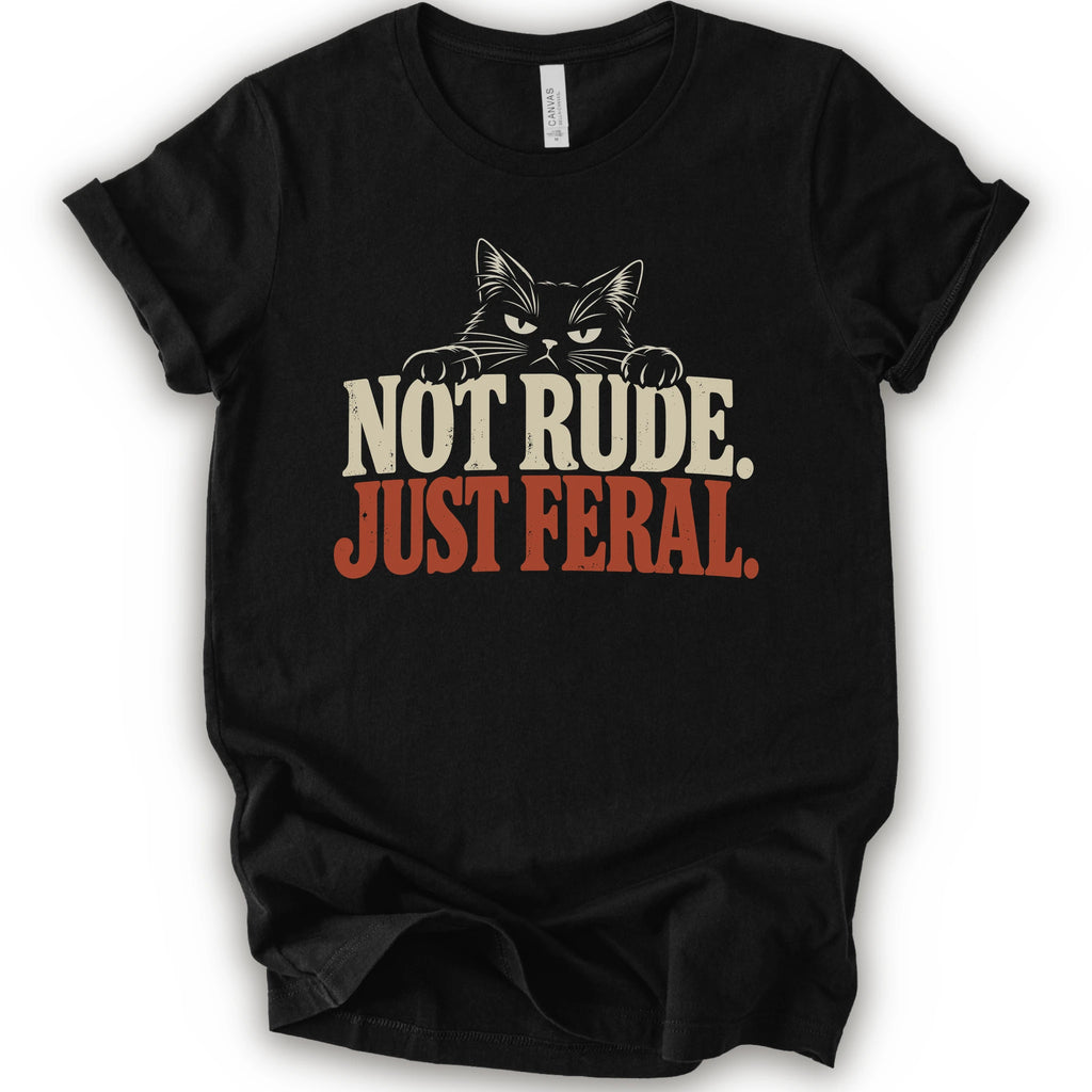 A black short-sleeve t-shirt with a graphic print of a cat with narrowed eyes and visible paws peers over the words “NOT RUDE.” above a large rust-colored “JUST FERAL.” The design uses bold distressed serif lettering in cream and rust with a retro graphic look.
