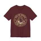 Red Tee with Black cat surrounded by candles and books in a vintage badge reading “Out of Office in My Cat’s Cult”
