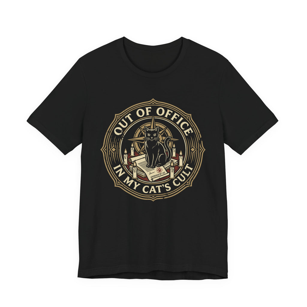 Black Tee with Black cat surrounded by candles and books in a vintage badge reading “Out of Office in My Cat’s Cult”