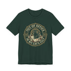 Green tee with Black cat surrounded by candles and books in a vintage badge reading “Out of Office in My Cat’s Cult”