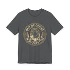 Grey Tee with Black cat surrounded by candles and books in a vintage badge reading “Out of Office in My Cat’s Cult”