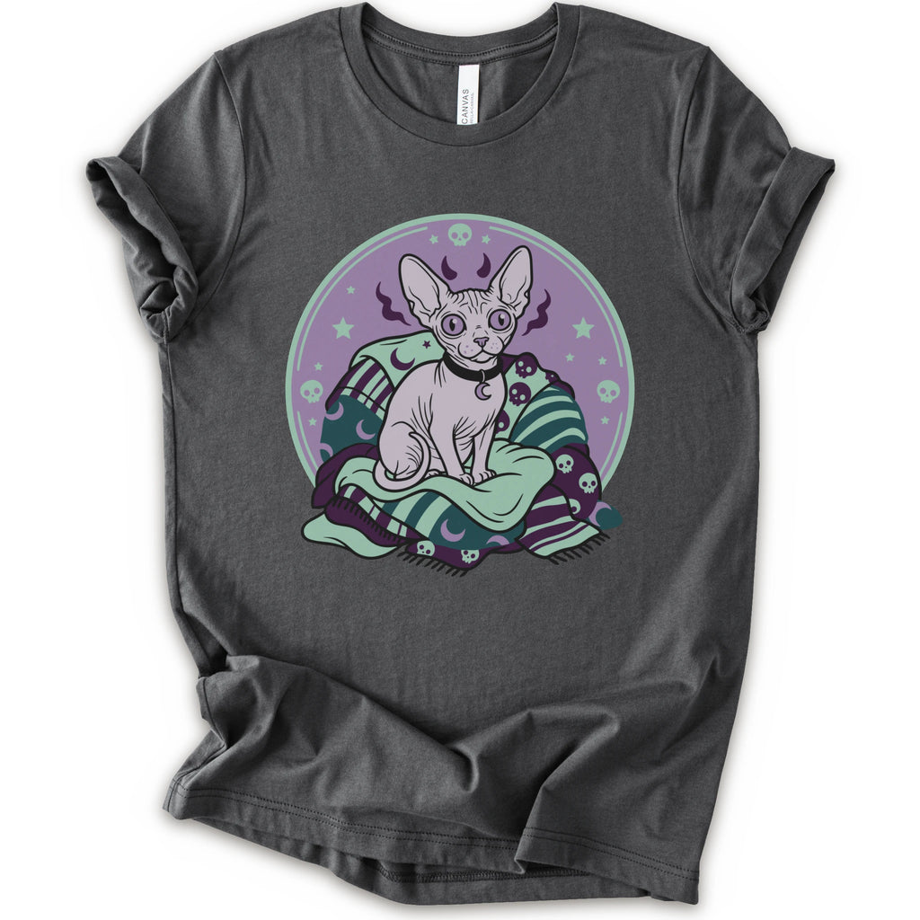A asphalt short-sleeve crewneck t-shirt featuring a graphic print of a hairless cat sitting on a green and purple patterned blanket inside a purple circular frame.
