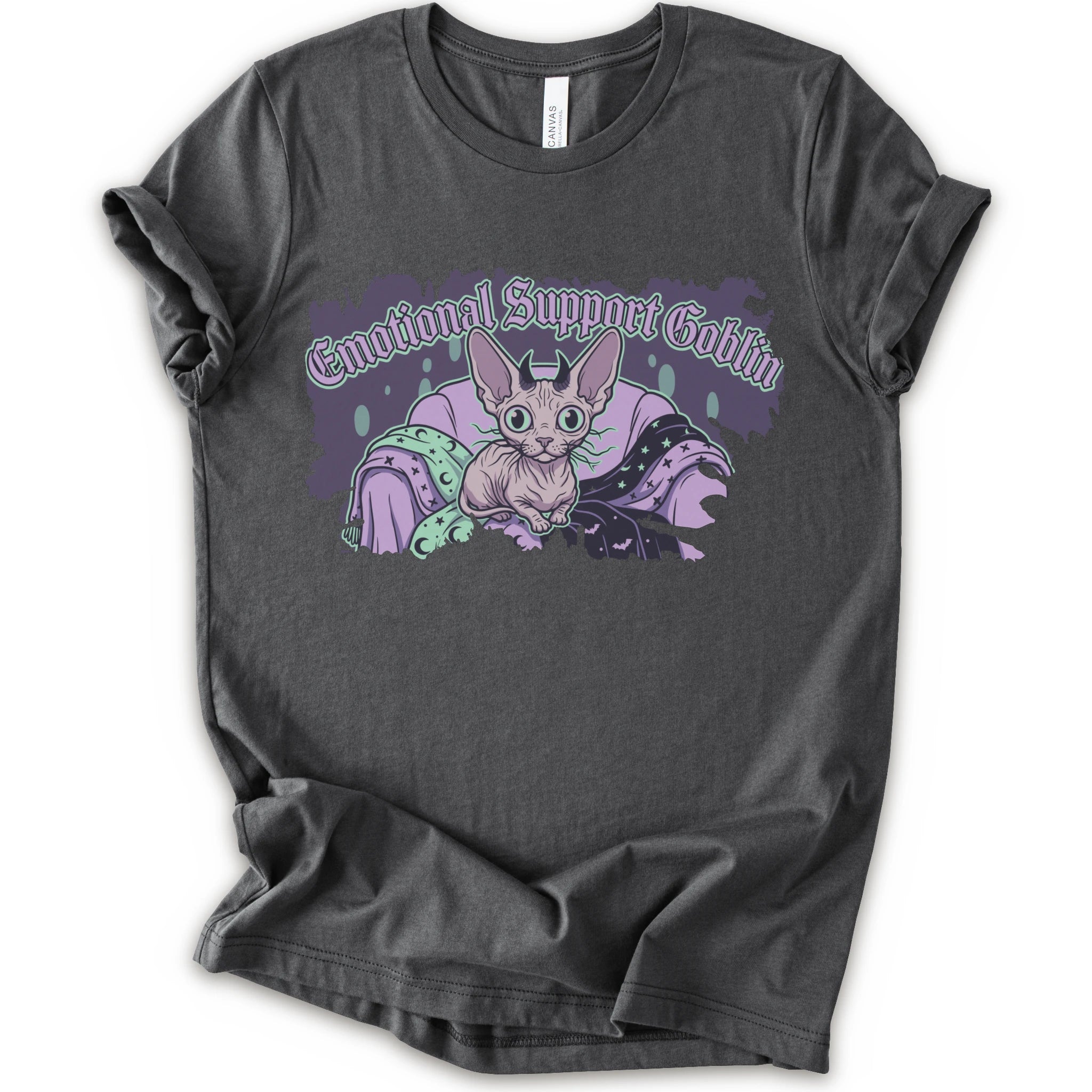 A asphalt short-sleeve t-shirt with a graphic print of a cartoon sphynx cat in a purple blanket with the text 'Emotional Support Goblin'.